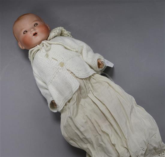An Armand Marseille open mouthed bisque headed doll